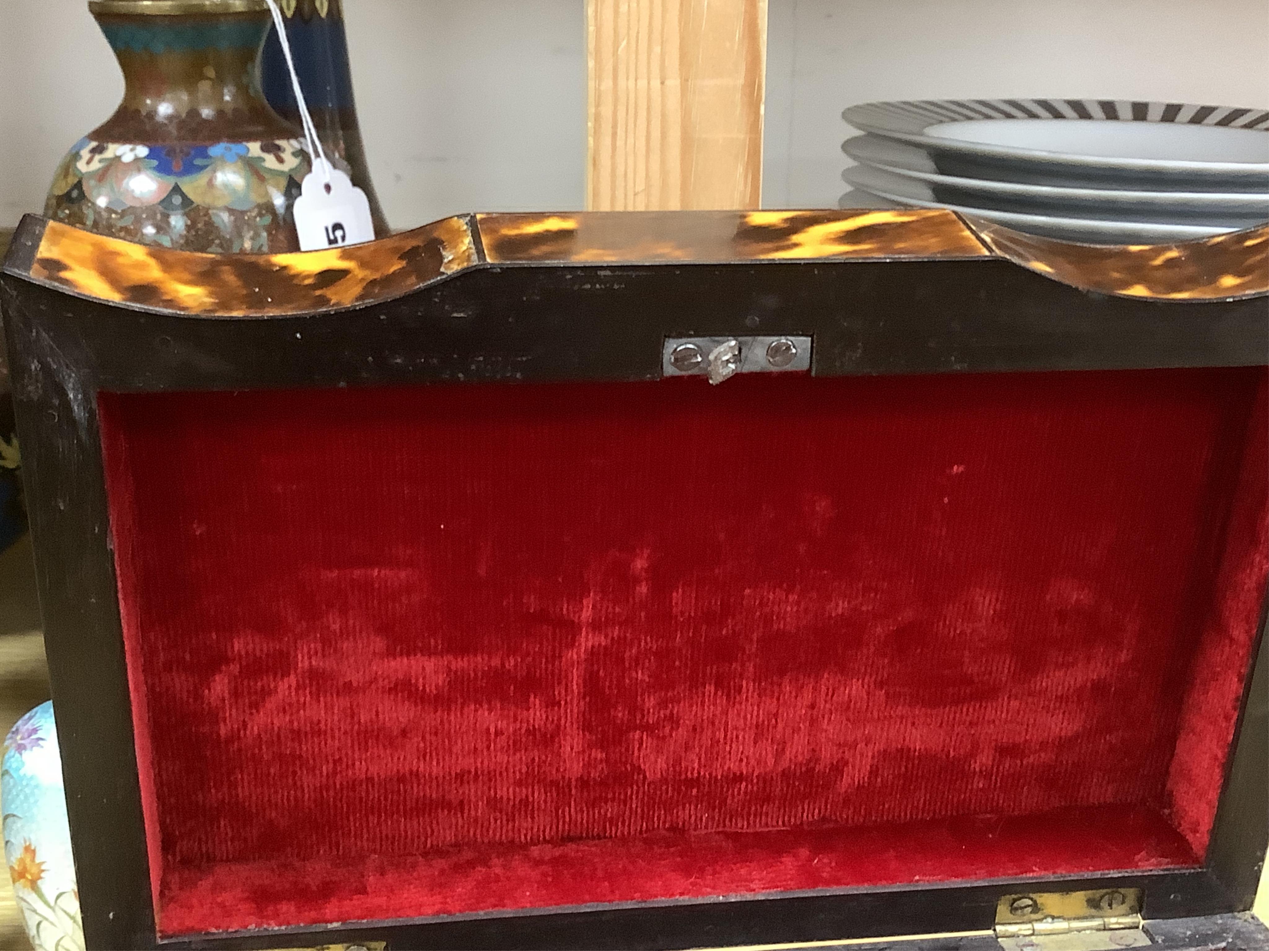 A 19th century tortoiseshell serpentine jewellery box with ivory ball feet and key, 20cm wide. Condition - some damage to tortoiseshell. CITES Submission reference, QRKRAJGK